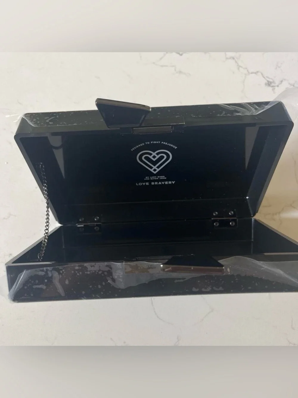 NIB Love Bravery Lady Gaga Elton John Women's Black Graphic Clutch  Face Accent
